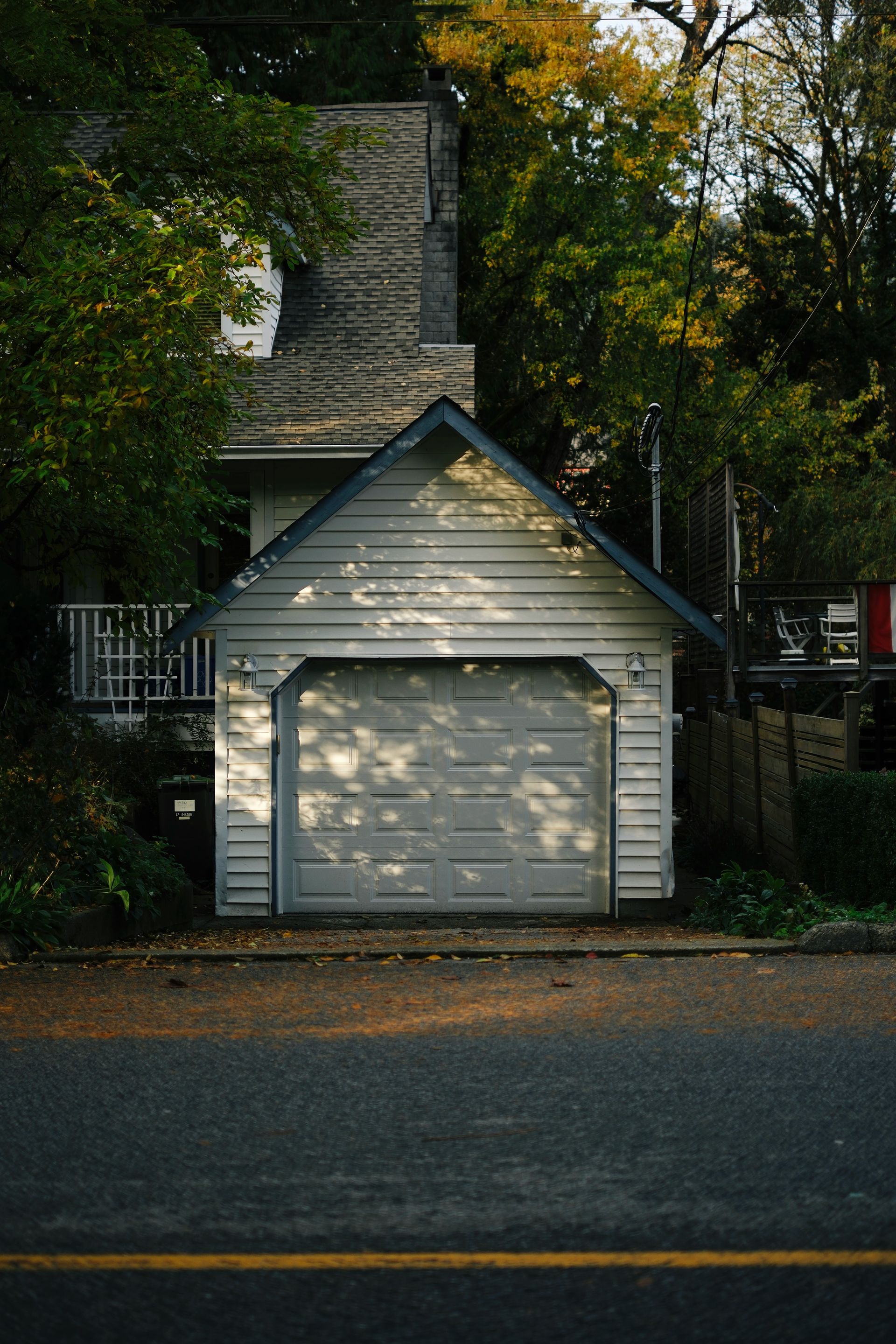 A detached garage with a driveway in front